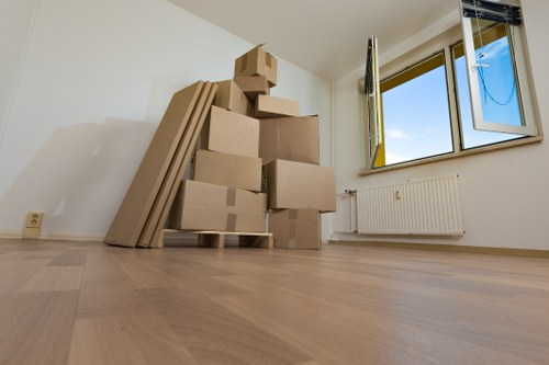 Staff member using proper lifting technique during a move