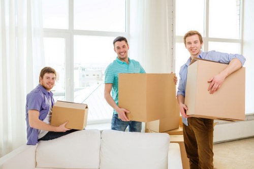Same day removals team loading boxes in Richmond upon Thames