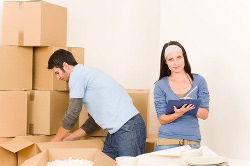 Movers transporting office furniture during a business relocation