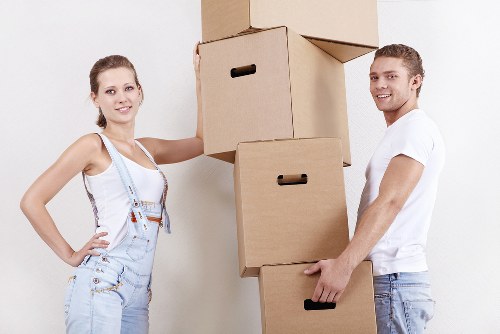 Local movers carrying belongings into a flat in Richmond upon Thames
